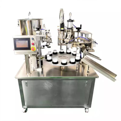 Macchina automatica per il riempimento e la sigillatura di tubi per crema azionata pneumaticamente